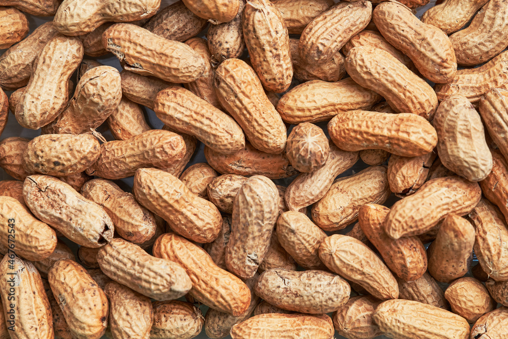 Healthy roasted unpeeled peanuts. Brown nuts texture Healthy roasted unpeeled peanuts. Brown nuts texture