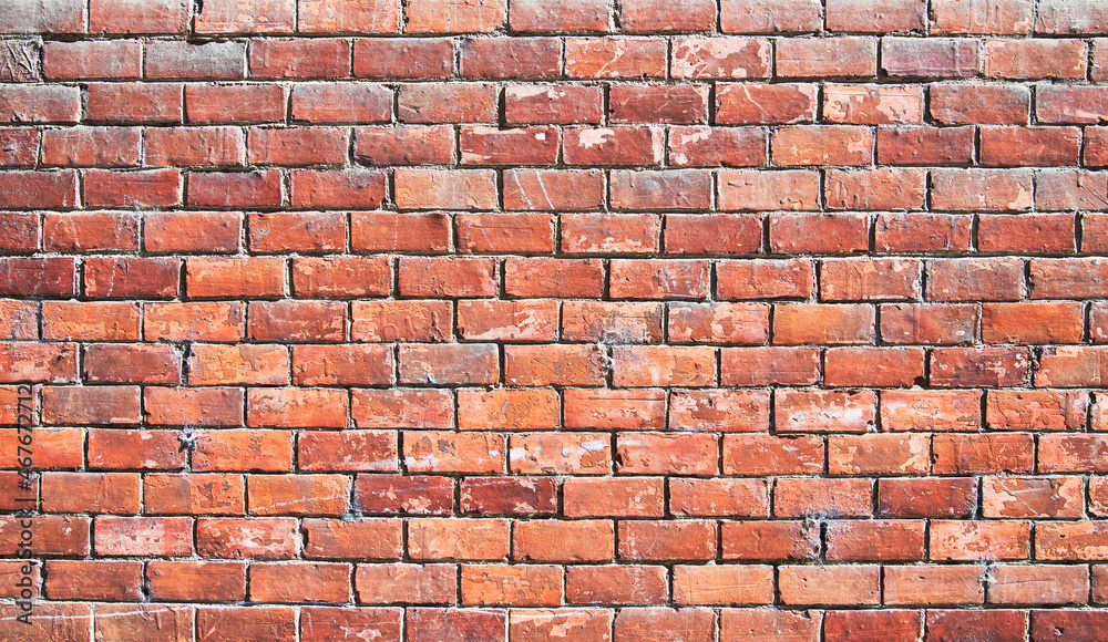 Fototapeta premium Brick wall texture with cracked tiles and cement. Classic brickwall surface background