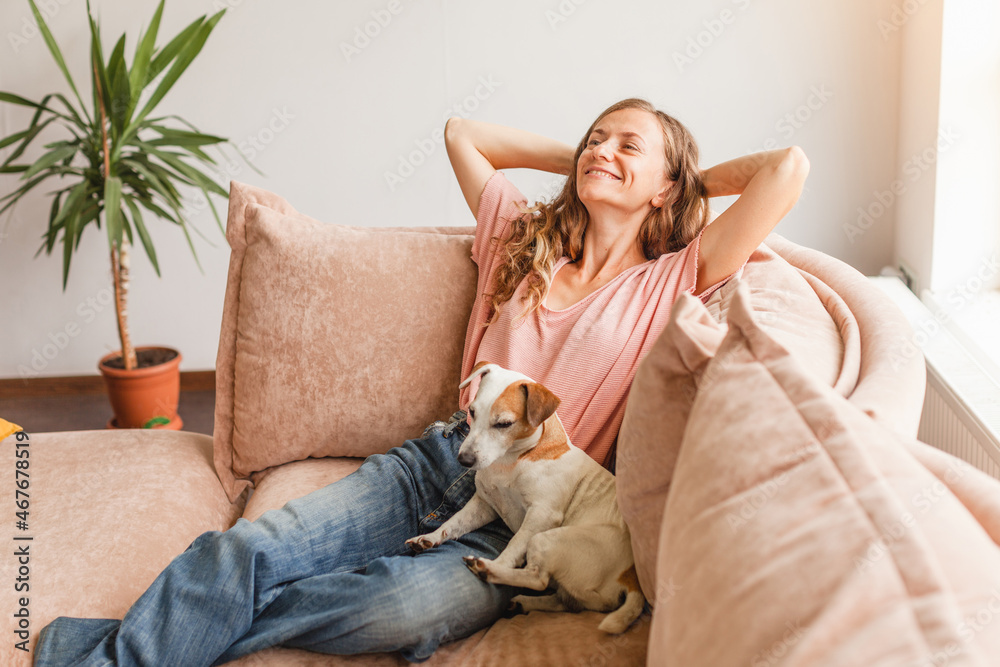 Young woman pretty relaxing on couch in living room Young woman pretty relaxing on couch in living room