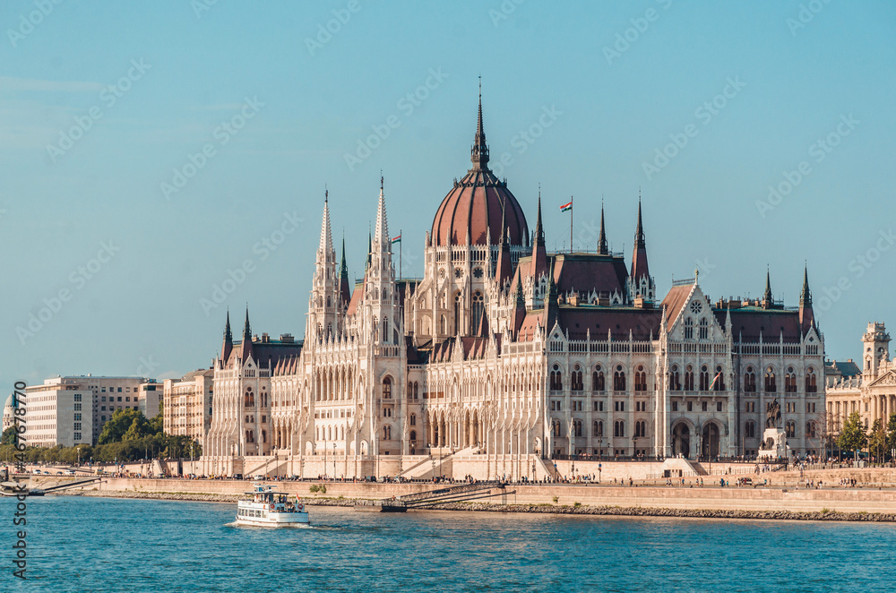 Hungarian Parliament building in Budapest at the daylight. 
Gothic architecture exterior. Tourist destination. Danube river bank