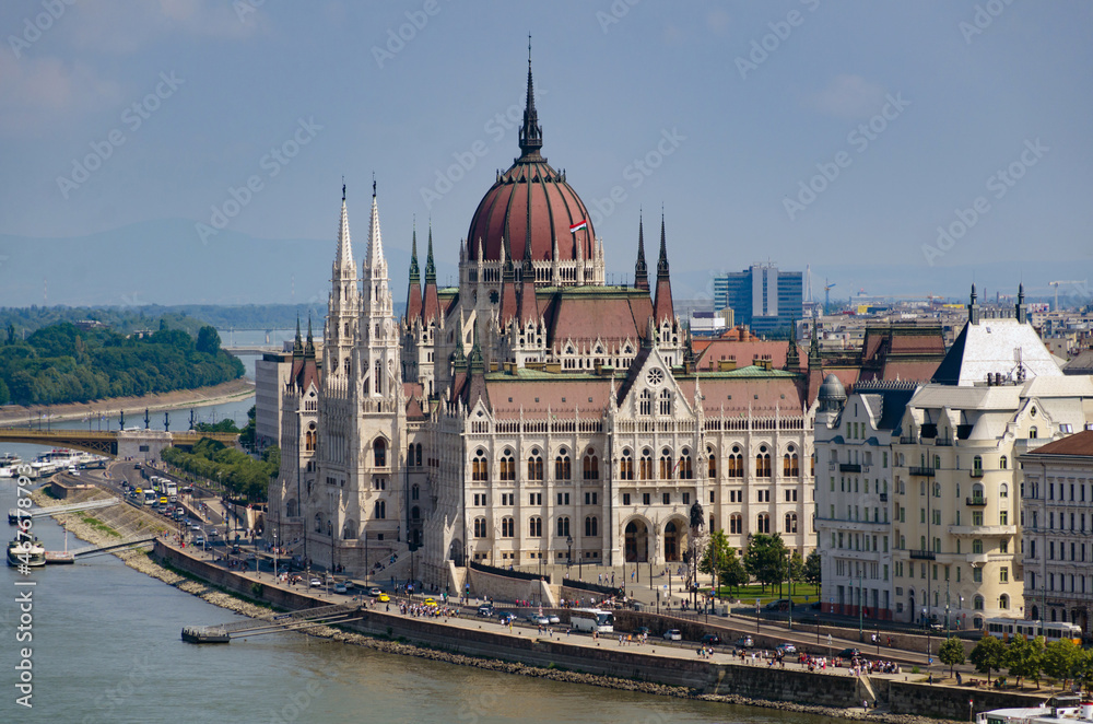 Hungarian Parliament building in Budapest at the daylight. 
Gothic architecture exterior. Tourist destination. Danube river bank