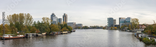Panorama of Amsterdam south with river Amstel and tall modern buildings in Omval neighborhood photo