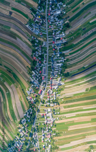 Obraz na płótnie Village, amazing in Poland from a bird's eye view from a drone. Sułoszowa - the longest village from the drone. w salonie