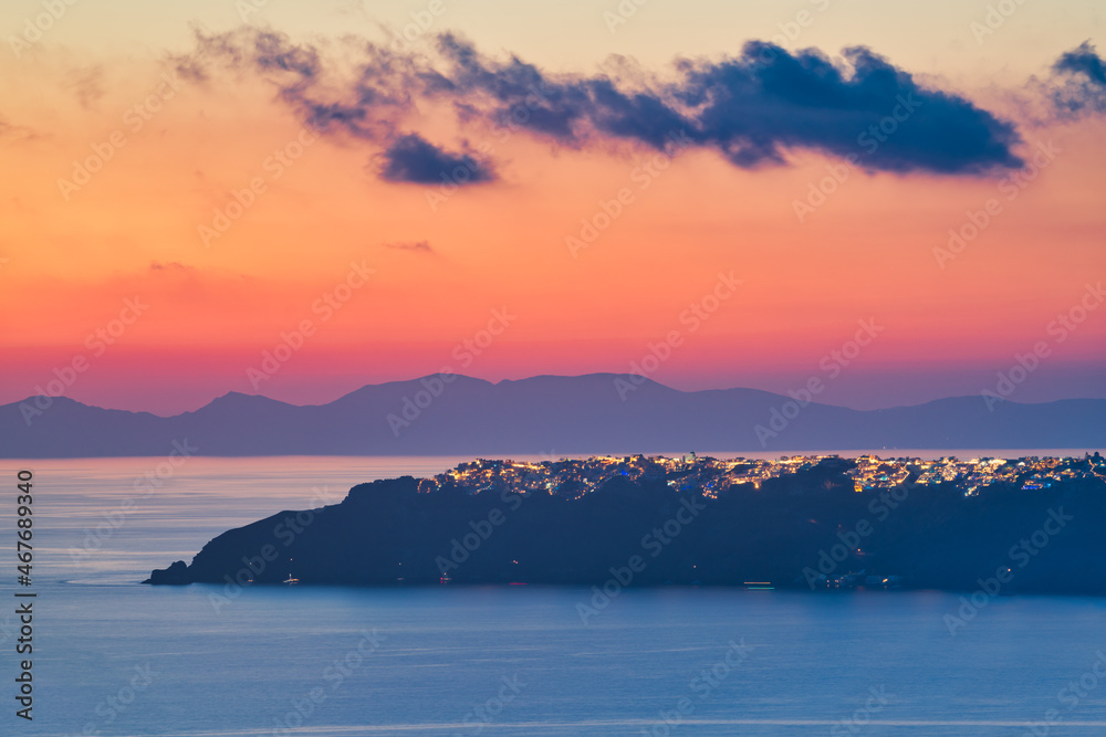 Oia village viewed from distance at sunset. Santorini Island. Greece