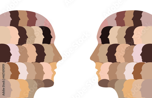 Two multicultural head silhouettes looking at each other. A representation of diversity and equality made of multicultural, ethnic faces with unique black and white race, cultural, skin tones