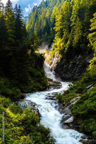 Wild River With Waterfall At Umbalfaelle On Mountain Grossvenediger In Nationalpark Hohe Tauern In Tirol In Austria photo