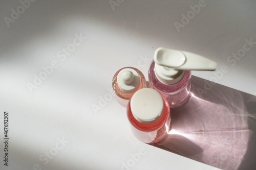 Elegant Cosmetic Bottle in Soft Pastel Tones on White Background