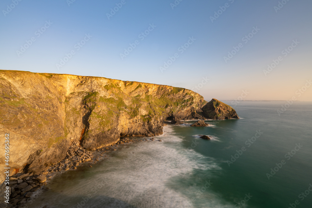 Golden hour view of the cliffs at Bedruthan Steps, North Cornwall, UK