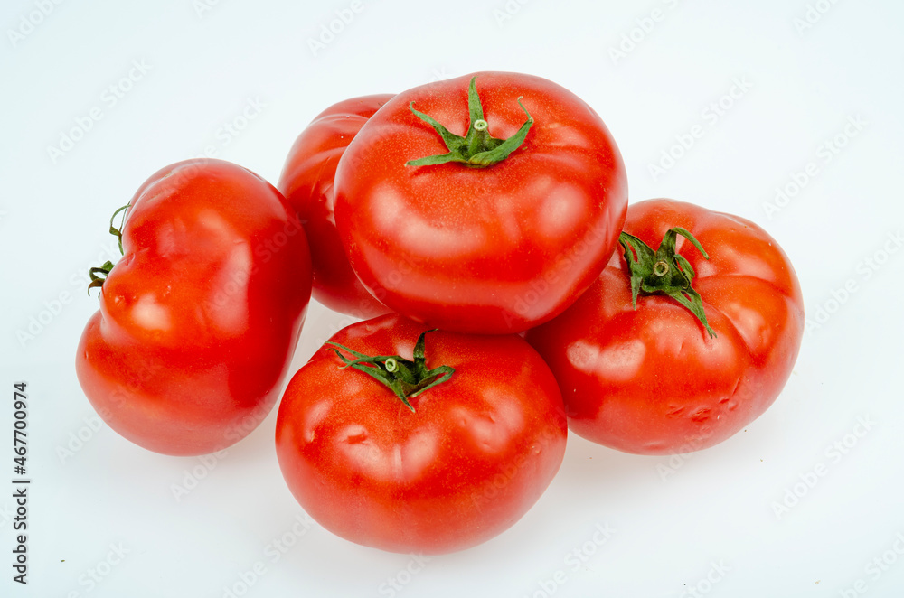Red, dark pink ripe tomatoes isolated on white background. Studio Photo Red, dark pink ripe tomatoes isolated on white background. Studio Photo