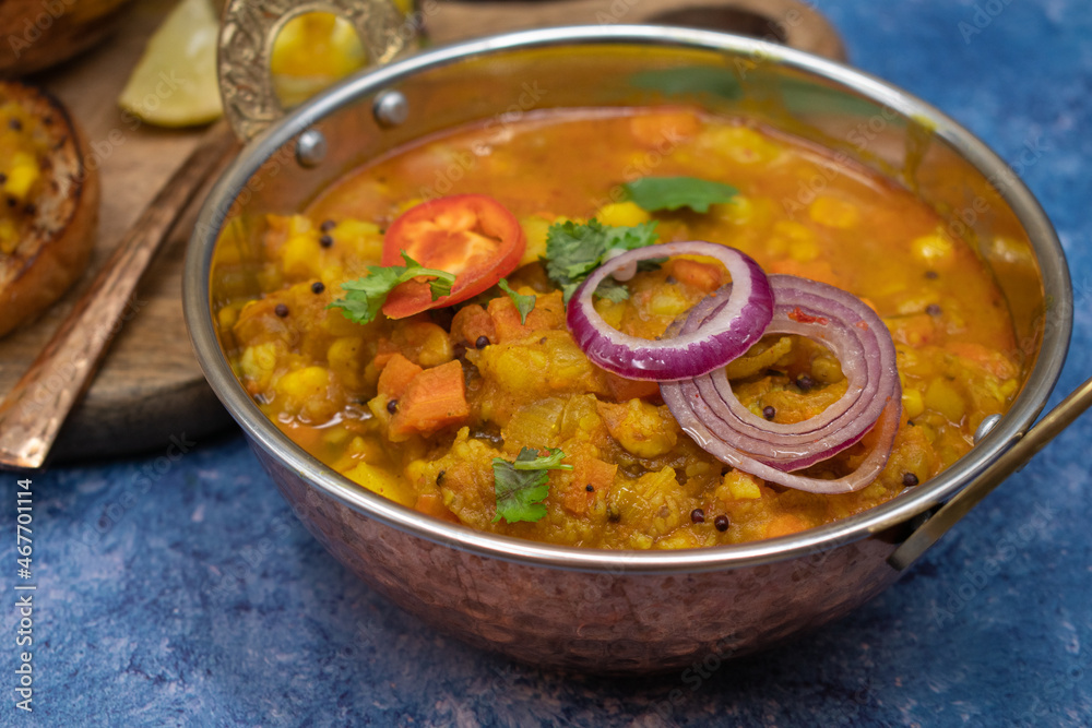 Vegetarian potato and mixed vegetables curry in indian style bowl Vegetarian potato and mixed vegetables curry in indian style bowl