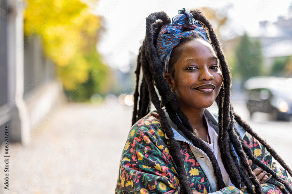 Fototapeta premium Portrait of confident young woman outdoors 