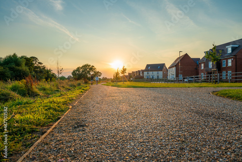 Empty walkway path at sunset near new build housing area in southern England