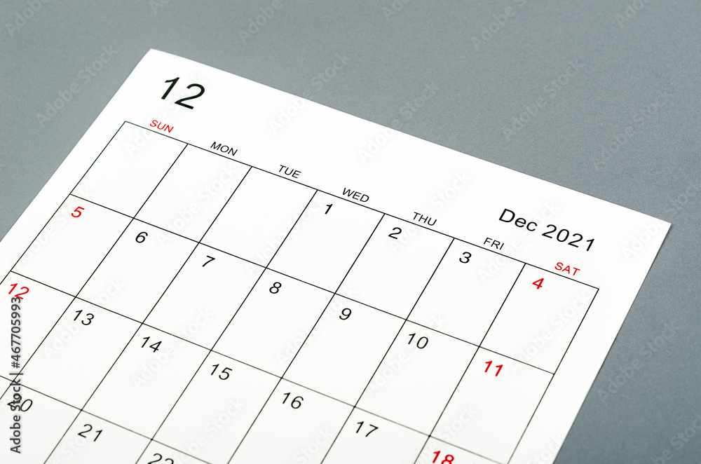 December 2021 calendar sheet on grey background. December 2021 calendar sheet on grey background.