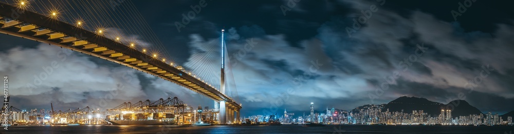 Naklejka premium Container terminal and stonecutter bridge in Hong Kong