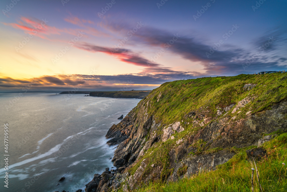 Love rock cliffs near Mullion Cove at sunset in Cornwall. United Kingdom