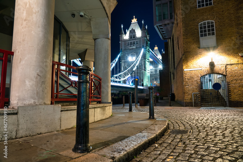 Photography Shade street overlooking side of Tower Bridge at night