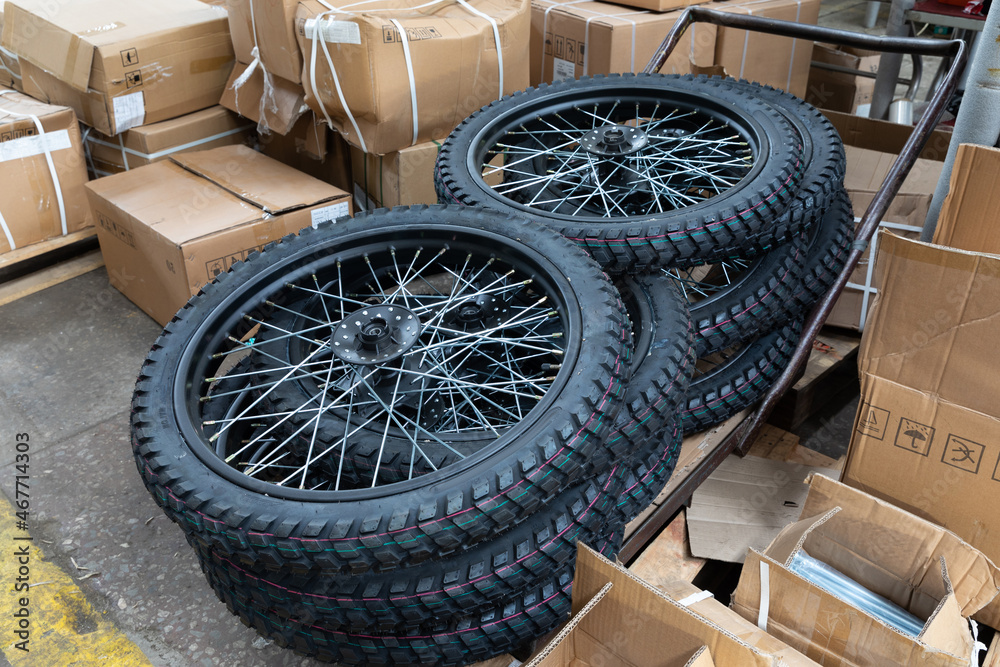 Naklejka premium new wheels before installation on motorcycle, assembly plant