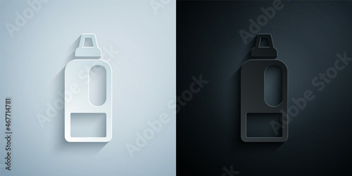Paper cut Plastic bottle for laundry detergent, bleach, dishwashing liquid or another cleaning agent icon isolated on grey and black background. Paper art style. Vector