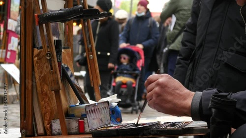 Street Artist Painter works with People Tourists in Montmartre, Paris
