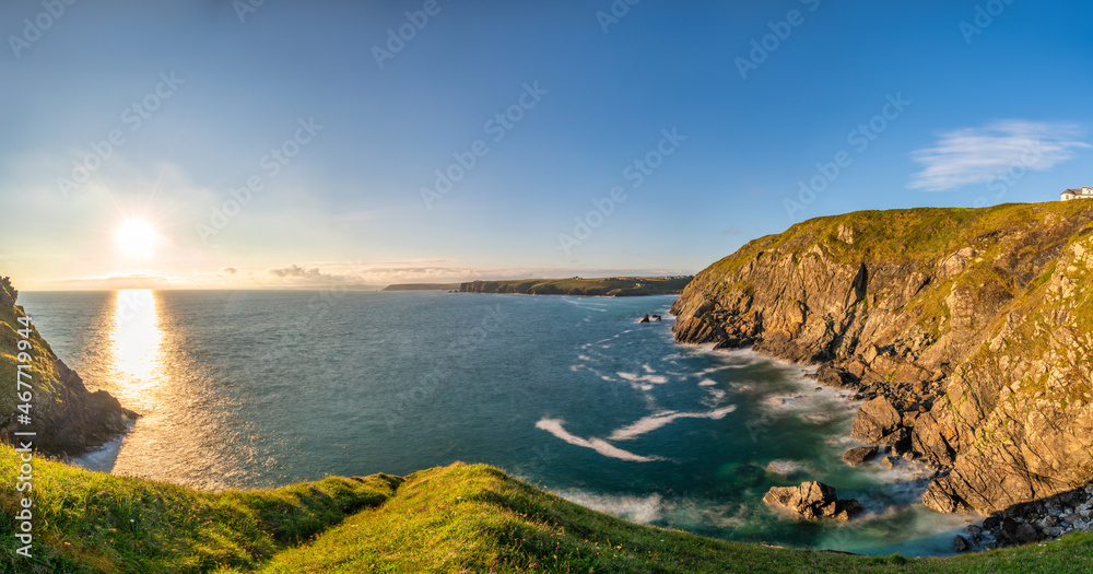 Love rock cliffs panorama of Mullion Cove at sunset in Cornwall. United Kingdom