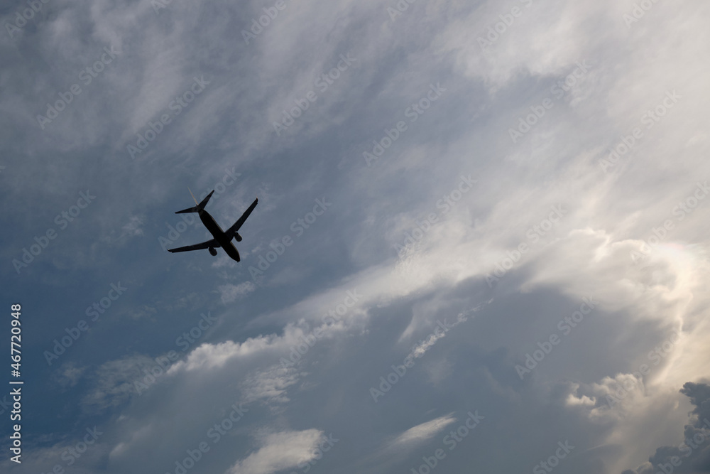 Airplane flying in the sky with clouds background Airplane flying in the sky with clouds background