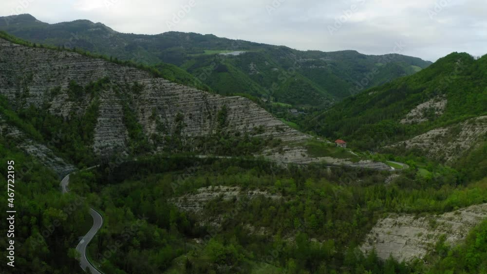 Aerial Beautiful Shot Of Car Moving On Road, Drone Flying Forward Over Forest - Apennine Mountains, Italy Aerial Beautiful Shot Of Car Moving On Road, Drone Flying Forward Over Forest - Apennine Mountains, Italy
