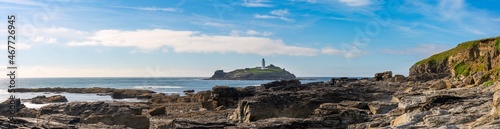 Gwithian Beach and Godrevy lighthouse in Cornwall. United Kingdom