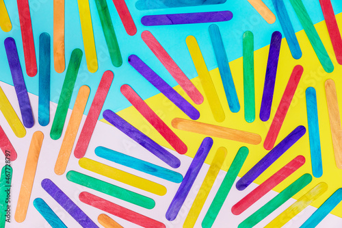 Colorful wooden sticks on color background. colorful ice cream stick , ice cream stick art. Wooden Popsicle Sticks.