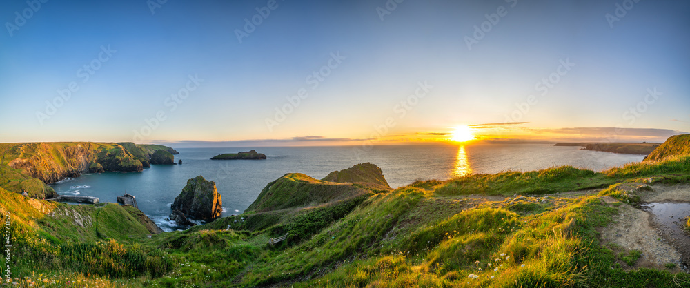 Fototapeta premium Mullion Cove at sunset in Cornwall. United Kingdom