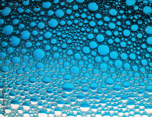 Blue bubbles background. Foam bubbles macro texture.