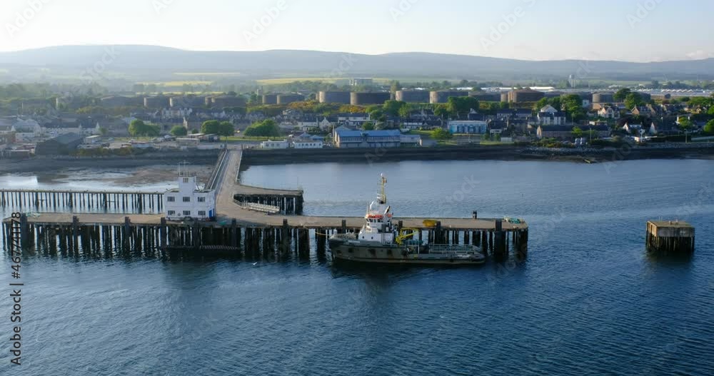 Aerial view of the pier and fishing seiner in the Cromarty Firth in Invergordon, Scotland, United Kingdom Aerial view of the pier and fishing seiner in the Cromarty Firth in Invergordon, Scotland, United Kingdom