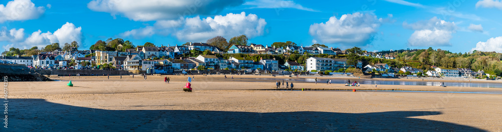 A panorama view across the front beach at Saundersfoot, South Wales on a sunny day