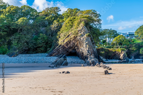A view up Glen Beach towards a cliff anticline at Saundersfoot, South Wales on a sunny day photo
