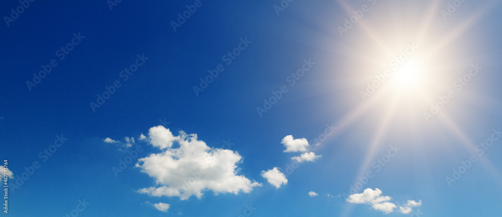blue sky , sun and beautiful white clouds. Wide photo.