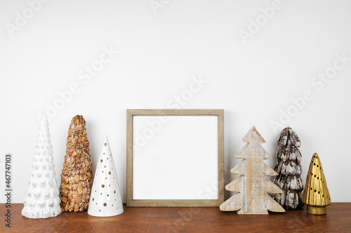 Photo Christmas mock up with wood frame and rustic tree decor