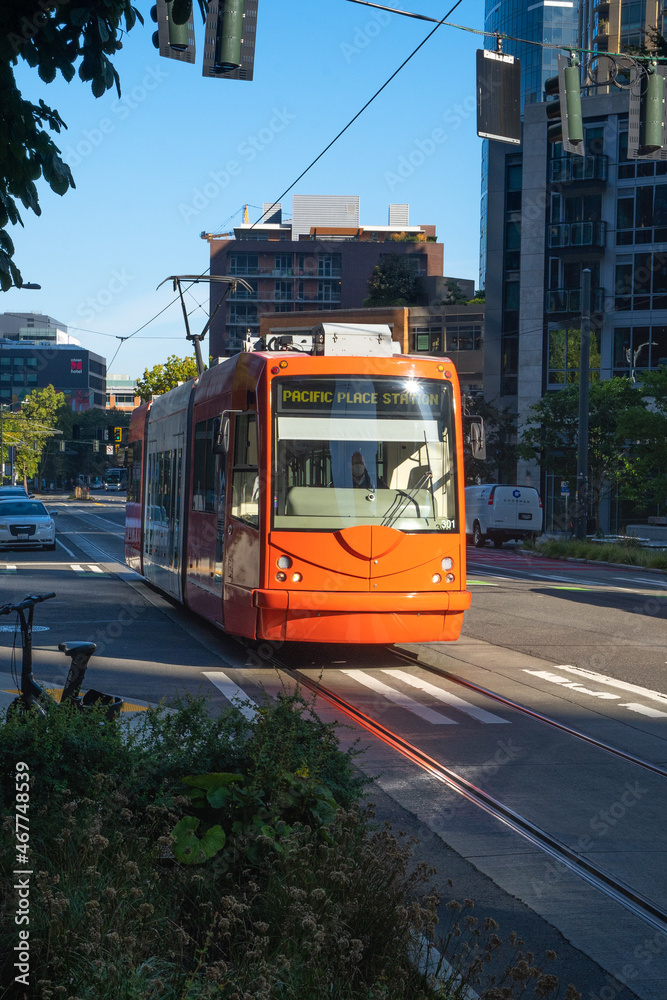 Seattle, WA - USA - Sept. 24, 2021: Vertical view of a Seattle Streetcar going by on Westlake Avenue.