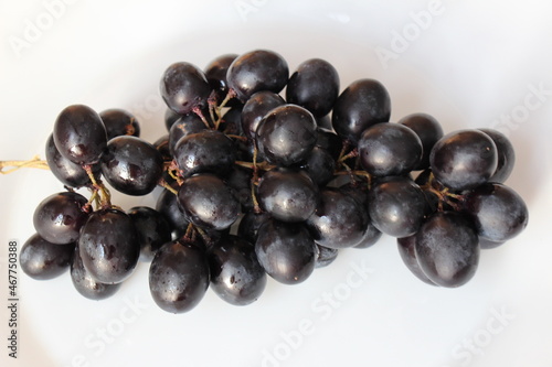 black grapes on a plate