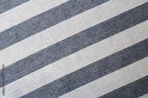 Textile background with light gray and white stripes. Fabric texture