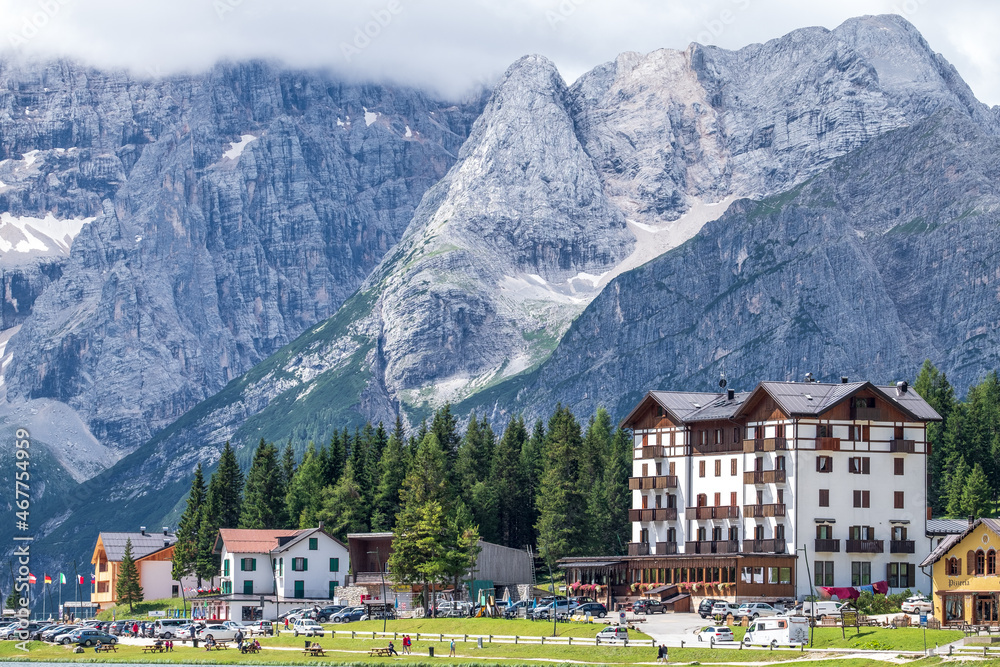 Fototapeta premium Misurina Lake in calm water. Stunning view on the majestic Dolomites Alp Mountains, Italy, National Park Tre Cime di Lavaredo.