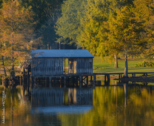 A Boat House among Bald Cypress Trees along the shoreline of Lake D''Arbonne. In Farmerville, Union Parish, Louisiana photo