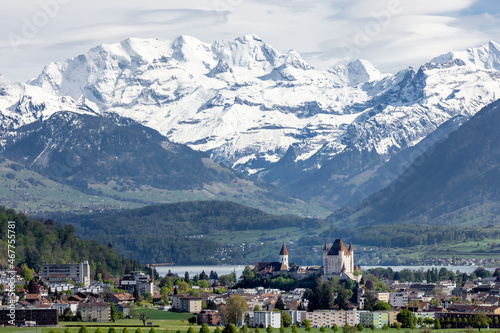 Castle near the lake in a mountainous region photo