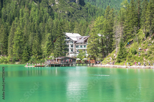 Lake Braies (also known as Pragser Wildsee or Lago di Braies) in Dolomites Mountains, Sudtirol, Italy. Romantic place with typical wooden boats on the alpine lake. Hiking travel and adventure. © Matteo