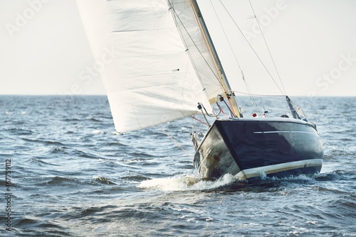 Heeled sloop rigged yacht sailing in an open Baltic sea on a clear day. Regatta, racing, sport, recreation, leisure activity, transportation, nautical vessel, adventure