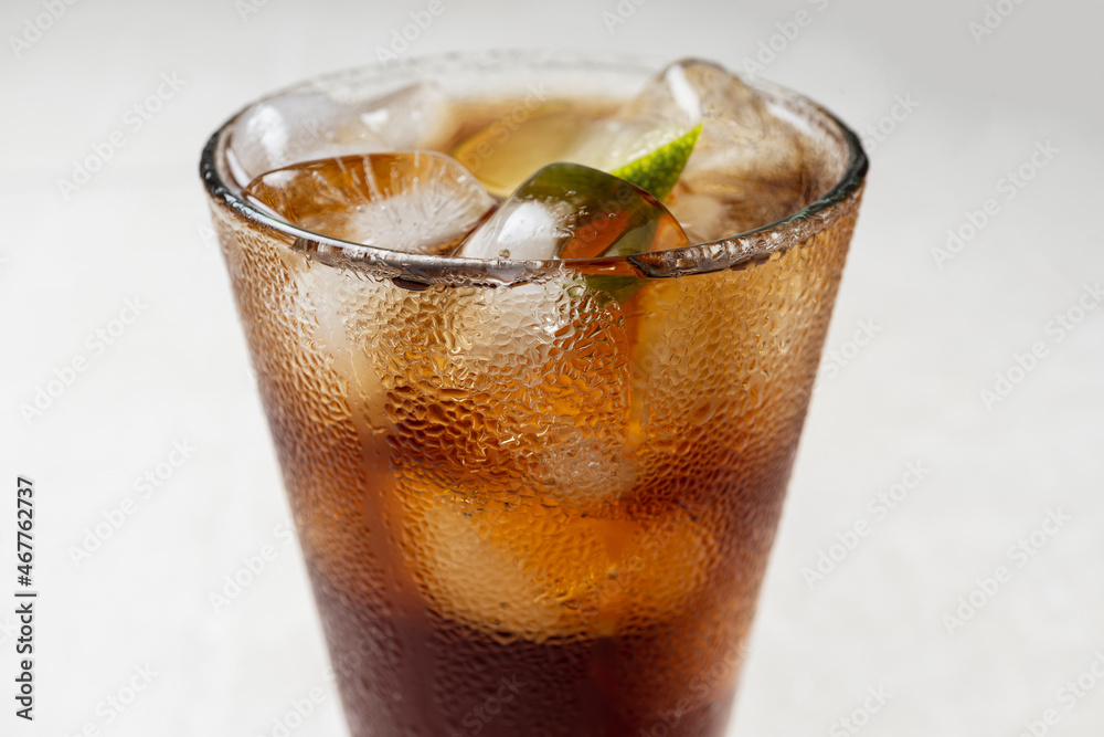 Alcoholic cocktail of rum with ice and lime, close-up, macro photography. Alcoholic cocktail of rum with ice and lime, close-up, macro photography.