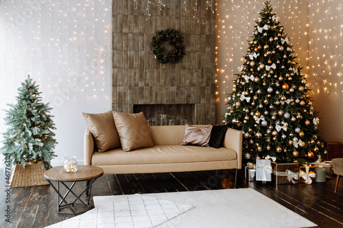 Stylish interior of living room with decorated Christmas tree