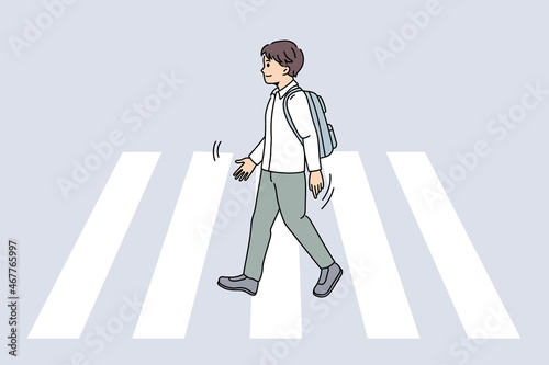 Personal safety and crosswalk concept. smiling boy pupil crossing road on crosswalk feeling confident and safe vector illustration 