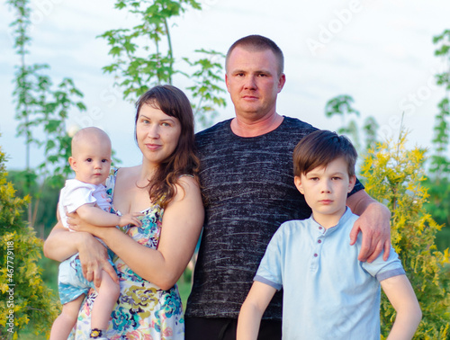 happy young family spending time outdoor on a summer day