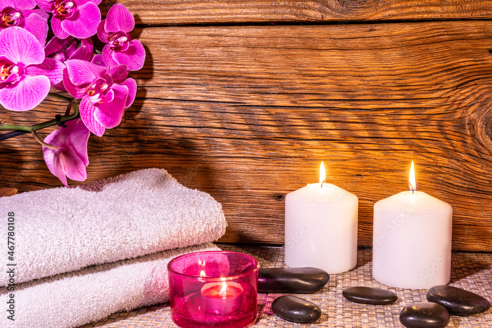 Spa, zen basalt stones, towels, candles in the massage room. Spa, zen basalt stones, towels, candles in the massage room.