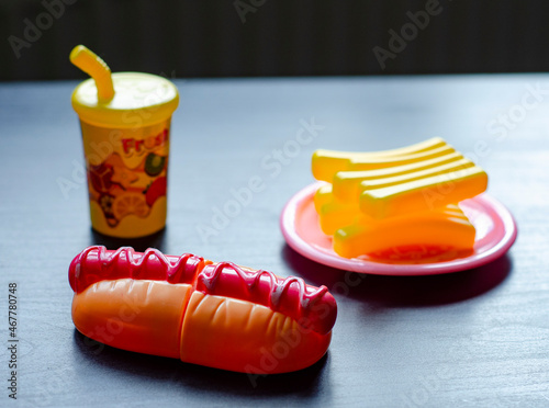Breakfast model with egg sausage bread and salad on plastic blue table background, play dought at home, child care cooking food model, educational toys for kid creative for toddlers concept.