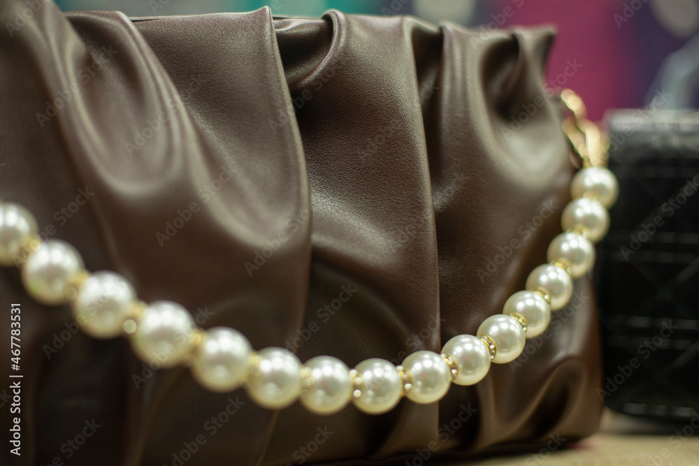 Obraz premium Women's leather bag. Leather substitute and imitation of pearls.